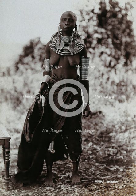 A young Masai woman, full length, wearing much jewellery, 1900. Creator: Unknown.