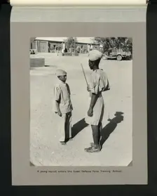 A young recruit enters the Sudan Defence Force Training School, 1964. Creators: Colonial Office, Unknown