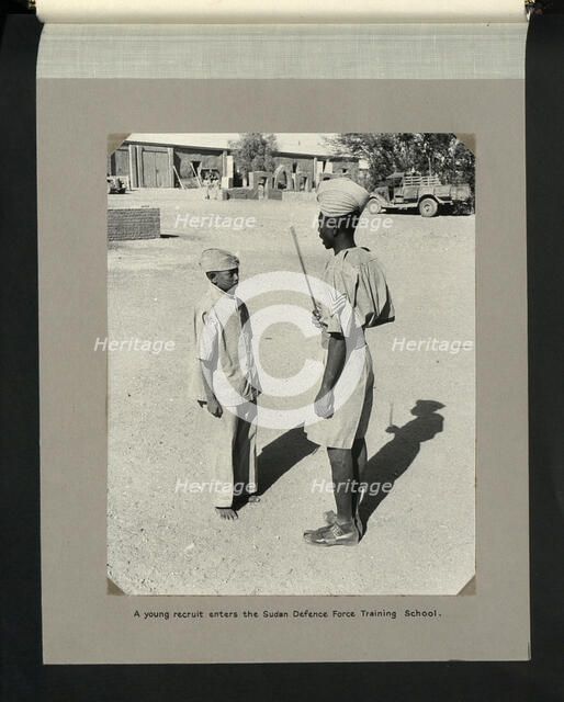 A young recruit enters the Sudan Defence Force Training School, 1964. Creators: Colonial Office, Unknown.