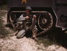 A young soldier of the armored forces holds and sights his Garand rifle like..., Fort Knox, Ky, 1942 Creator: Alfred T Palmer