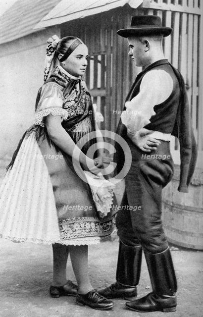 A young Slovak couple, Hungary, 1926.Artist: AW Cutler