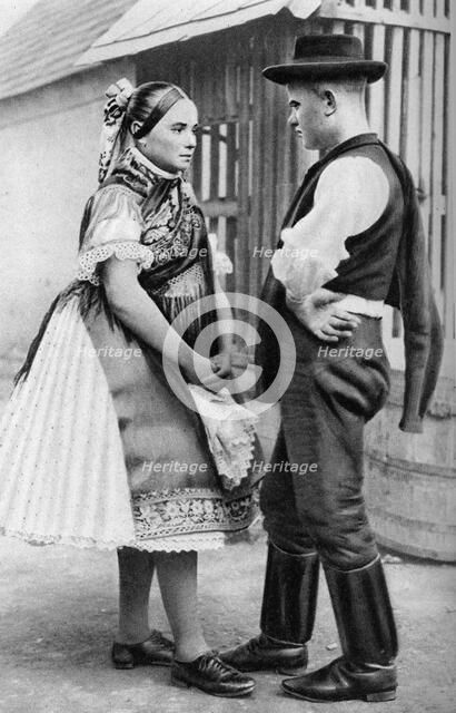 A young Slovak couple, Hungary, 1926.Artist: AW Cutler