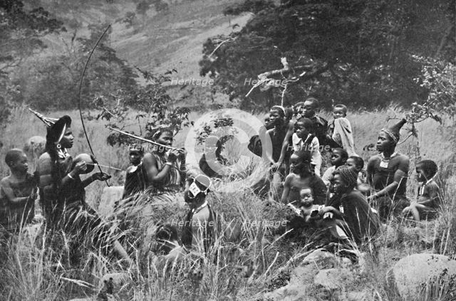 A Zulu musician and audience, 1912. Artist: Unknown.