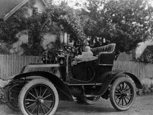 A baby on the seat of a De Dion Bouton car, 1903