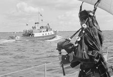 A bagpiper on board the ocean cruiser Avalanche off Landskrona, Sweden, 1965
