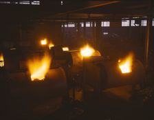 A battery of 1,000 and 2,000 pound furnaces roaring threats to..., Aluminum Industries Inc. , 1942. Creator: Alfred T Palmer