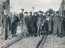 A batch of Neuve Chapelle wounded on a French railway station, 1915