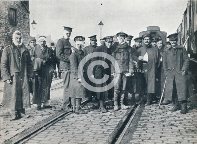 A batch of Neuve Chapelle wounded on a French railway station, 1915. Artist: Unknown