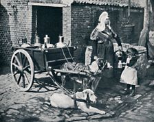 A Belgian peasant woman and her draught dogs, 1912. Artist: Neurdein freres