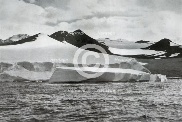 'A Berg Calving from a Glacier at Cape Crozier', c1911, (1913). Artist: Herbert Ponting.