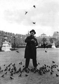 A bird charmer, Paris, 1931.Artist: Ernest Flammarion