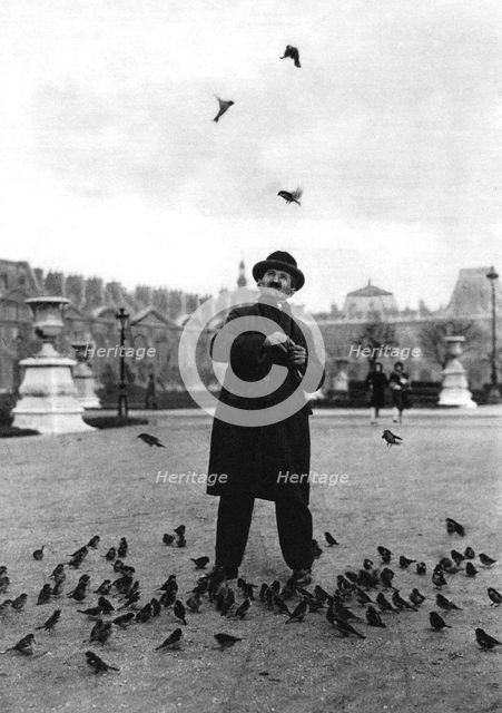 A bird charmer, Paris, 1931.Artist: Ernest Flammarion