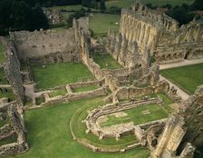 A birds-eye view of buildings around the cloister at Rievaulx Abbey, North Yorkshire, 1994. Artist: Paul Highnam