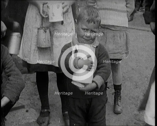 A Boy Clutching a Jug To His Chest and Crying, 1924. Creator: British Pathe Ltd.