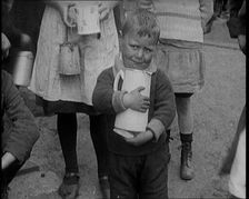 A Boy Clutching a Jug To His Chest and Crying, 1924. Creator: British Pathe Ltd