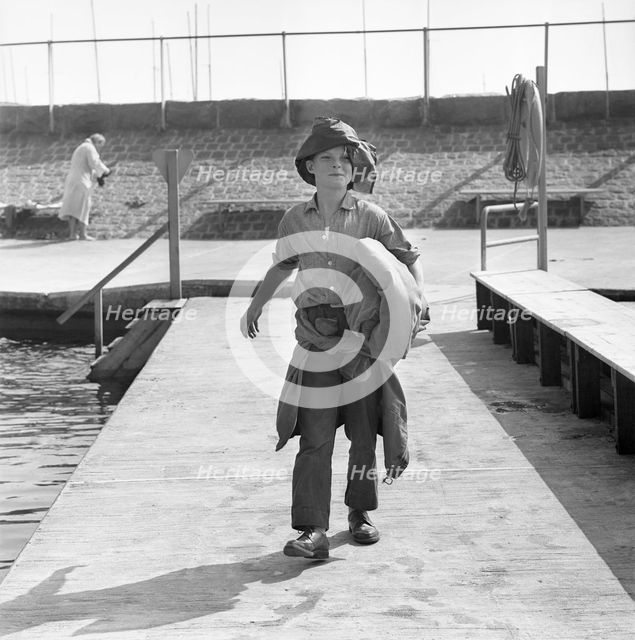 A boy on the jetty, Borstahusen, Landskrona, Sweden, 1964. Creator: Unknown.