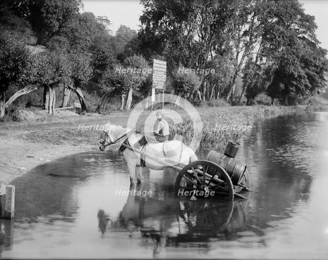 A boy with a horse drawn water cart, filling up in the River Thames, Shiplake, Oxfordshire,1860-1922 Creator: Henry Taunt.