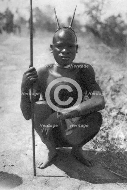 A boy with 'horns', Abercorn to Tukuyu, Tanganyika, 1925 (1927). Artist: Thomas A Glover