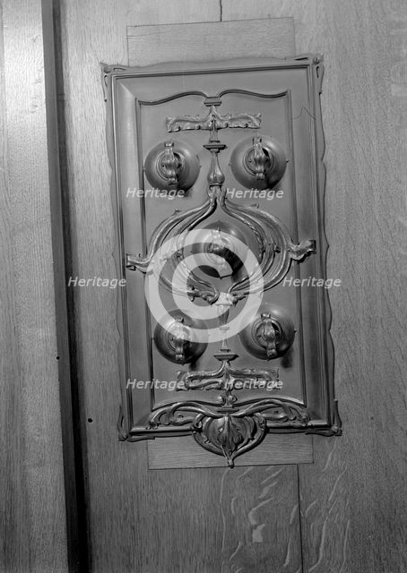 A bronze switch plate in the John Rylands Library, University of Manchester, 1942.   Creator: GB Wood.
