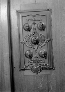 A bronze switch plate in the John Rylands Library, University of Manchester, 1942. Creator: GB Wood
