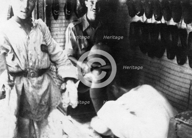 A British officer in a shoe shop, Baghdad, Mesopotamia, WWI, 1918. Artist: Unknown