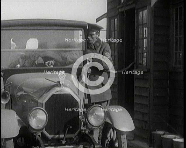 A British Automobile Association Employee Filling a Car With Petrol at the First Petrol Station,1920 Creator: British Pathe Ltd.