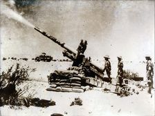 A British artillery piece in action, south of El Alamein, 1942