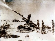 A British artillery piece in action, south of El Alamein, 1942. Creator: Unknown