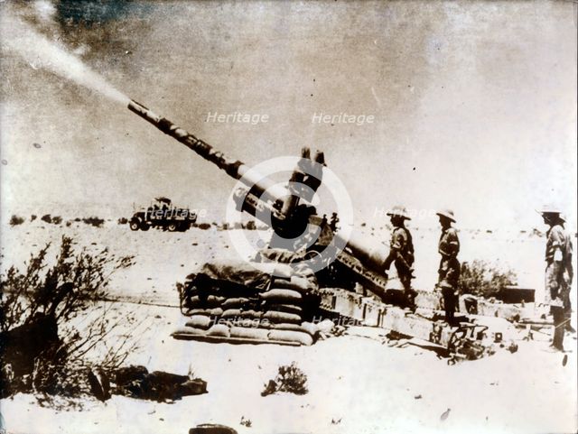A British artillery piece in action, south of El Alamein, 1942. Creator: Unknown.