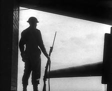A British Soldier Guarding a Gun Emplacement, 1940. Creator: British Pathe Ltd