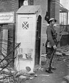 A British soldier on sentry duty after the fall of Peronne, France, First World War, 1917, (c1920)