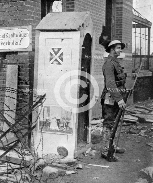 A British soldier on sentry duty after the fall of Peronne, France, First World War, 1917, (c1920). Artist: Unknown