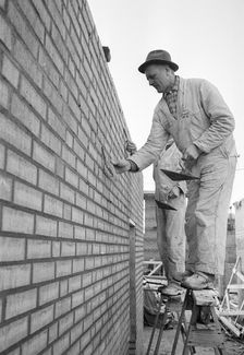 A bricklayer at work, Landskrona, Sweden, 1965