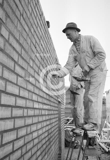 A bricklayer at work, Landskrona, Sweden, 1965. Artist: Unknown