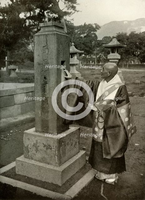 'A Buddhist Priest and Praying-Wheel', 1910. Creator: Herbert Ponting.