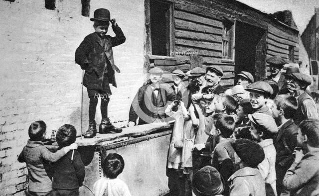 A budding Charlie Chaplin admirer, east end of London, 1926-1927. Artist: Unknown