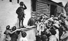 A budding Charlie Chaplin admirer, east end of London, 1926-1927