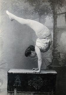 A Bulgarian female acrobat standing on her hands, early 20th century. Creator: Unknown