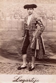 A bullfighter, Rafael Molina Sanchez "Lagartijo", posing in front of a painted back..., c1870s. Creator: Unknown