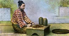 A Burmese woman making cigars, c1900s
