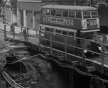 A Bus Driving Across a Wooden Bridge, 1940. Creator: British Pathe Ltd