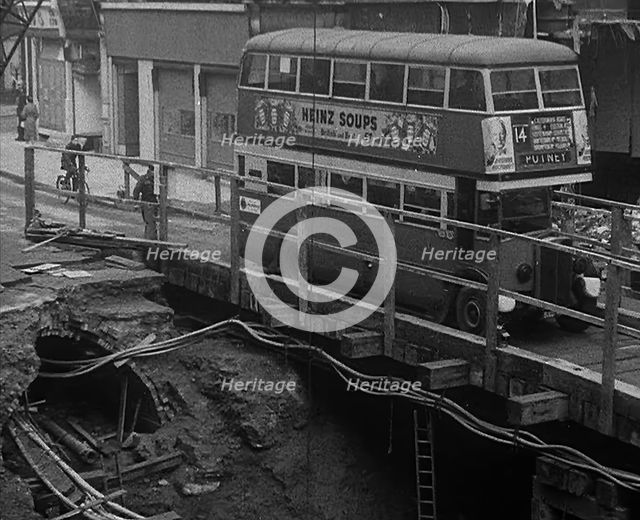 A Bus Driving Across a Wooden Bridge, 1940. Creator: British Pathe Ltd.