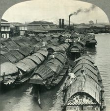 A Busy Scene on the Pasig River, Manila, Island of Luzon, P.I. - Cascos, the Cargo Lighters and Coa Creator: Unknown