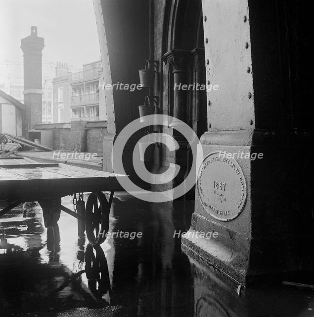 A Butterley Iron Company plaque dated 1867 located on a plinth...St Pancras Station, 1960-72. Creator: John Gay.