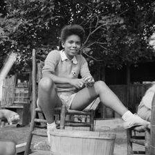 A camper helping with the kitchen work at Camp Gaylord White, Arden, New York, 1943. Creator: Gordon Parks