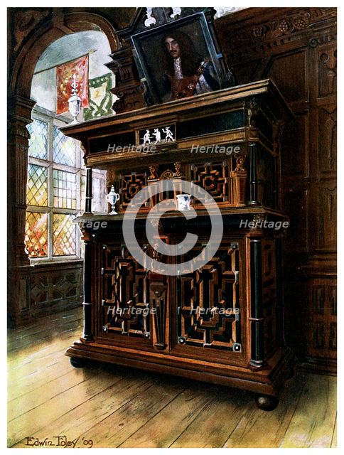 A cabinet of oak and walnut, 1910.Artist: Edwin Foley