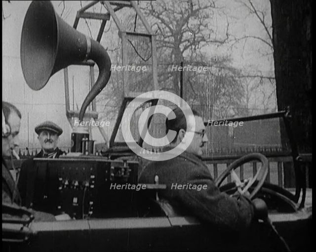 A Car on the Road Equipped with a Radio, an Aerial, and Speakers, 1922. Creator: British Pathe Ltd.