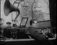 A Car on the Road Equipped with a Radio, an Aerial, and Speakers, 1922. Creator: British Pathe Ltd