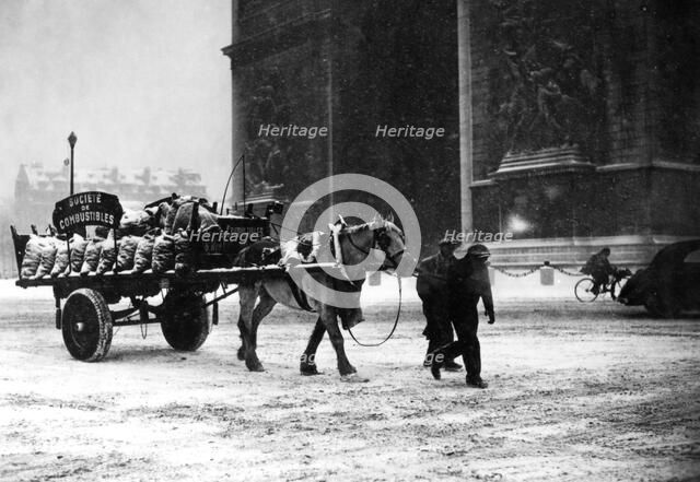 A cartload of scarce coal, occupied Paris, January 1941. Artist: Unknown