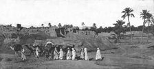 'A Caravan approaching an old Fort in Biskra 1890. Creator: Unknown